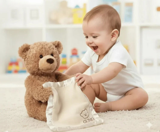 Baby playing peek-a-boo with teddy